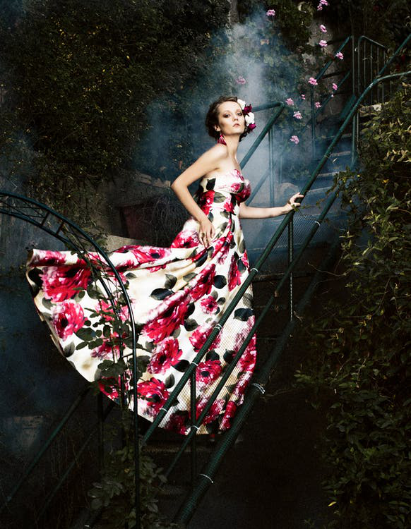 woman in red and white floral dress